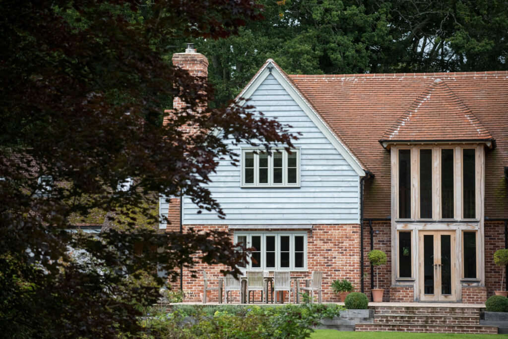 Country home in brick and weatherboard with large windows