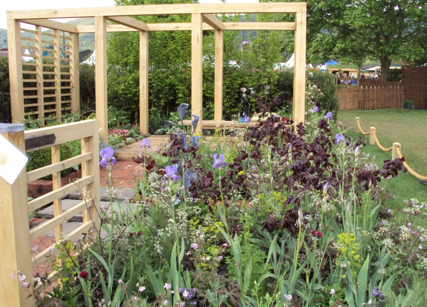 Pergola in garden with flowers