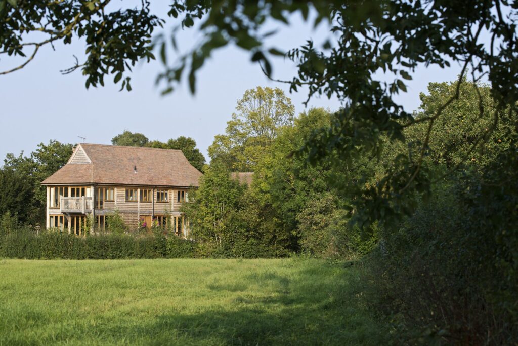 oak frame home with fields